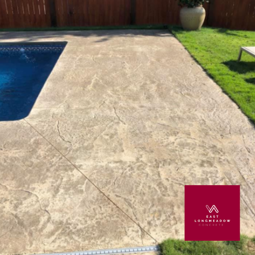 swimming pool with stamped concrete deck